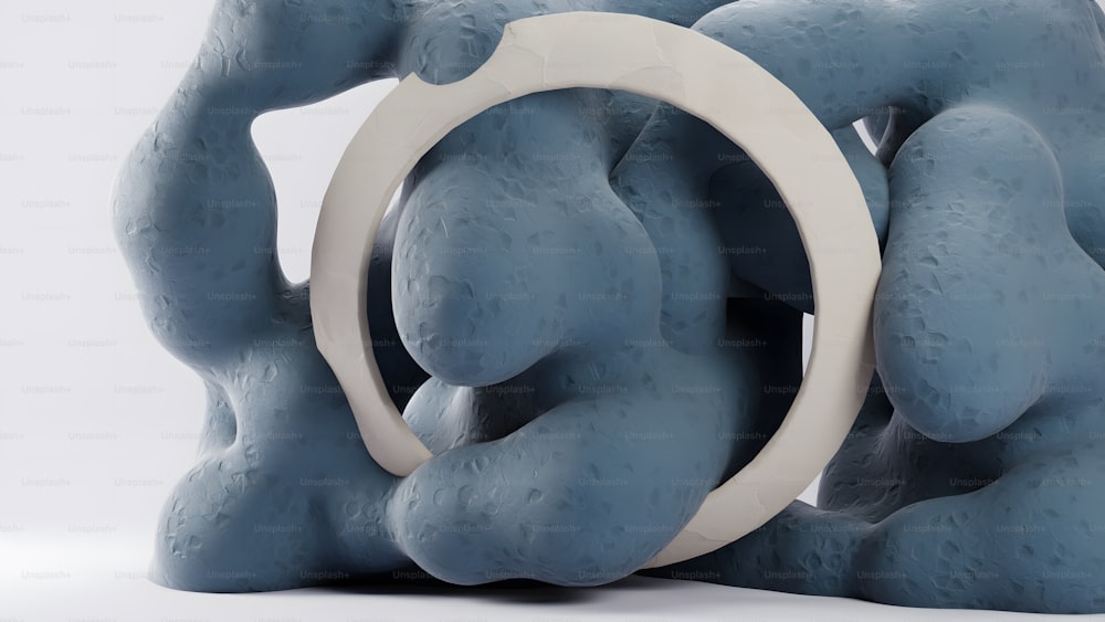 a blue sculpture with a white ring around it