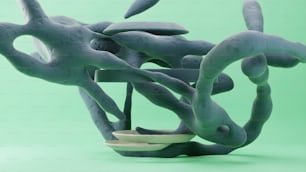 a sculpture made out of clay on a green background