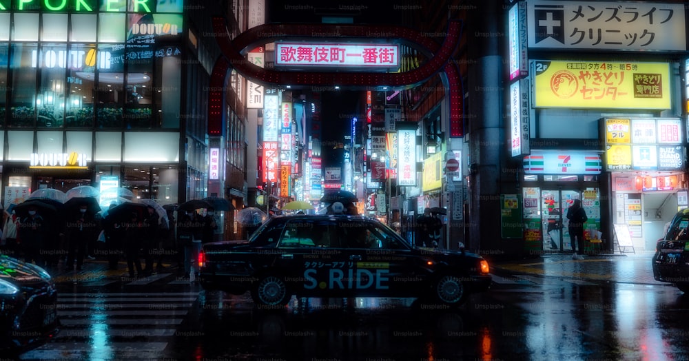 a busy city street at night with neon signs