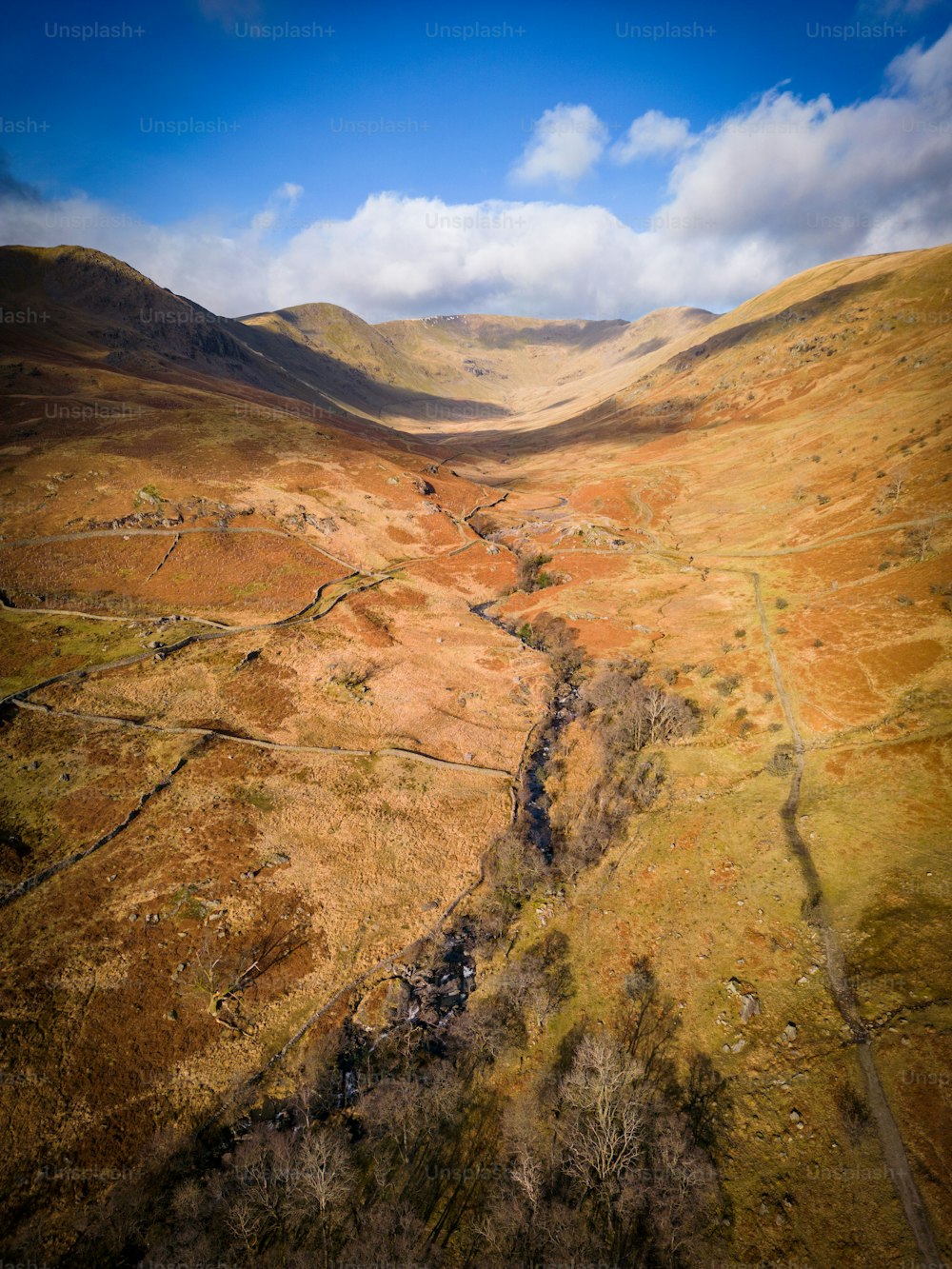 an aerial view of a valley in the mountains