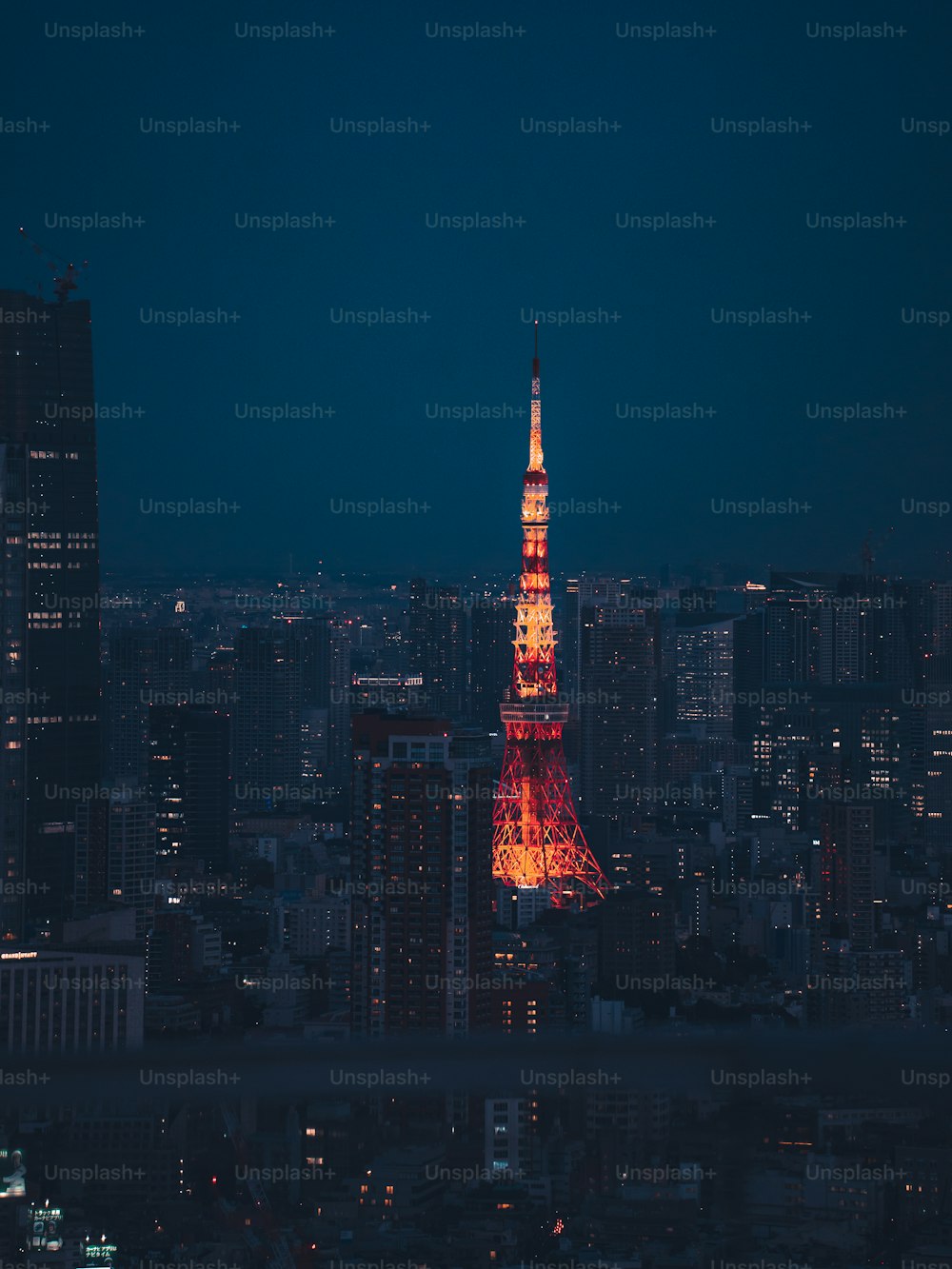 the eiffel tower is lit up in red