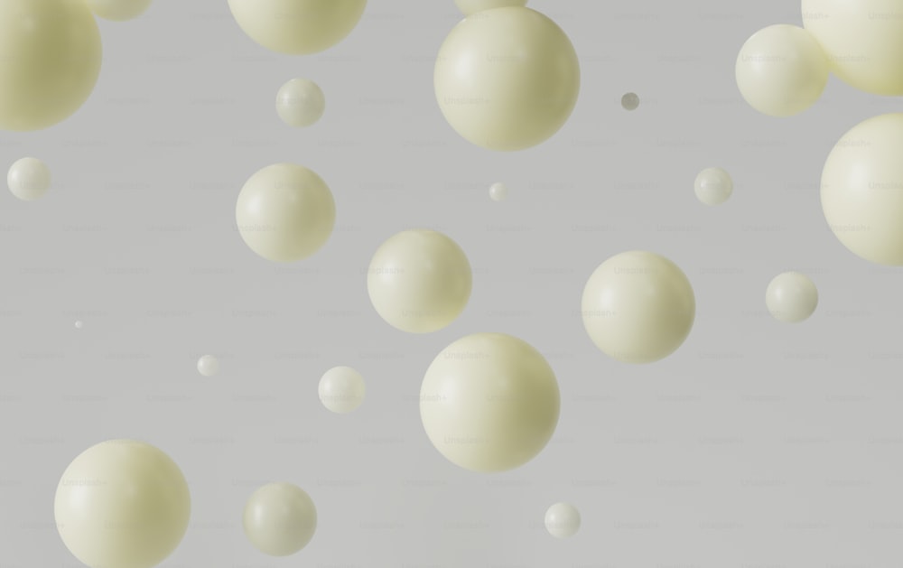 um grupo de bolas brancas flutuando no ar