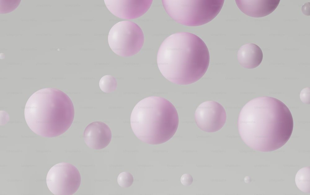 um grupo de bolas cor-de-rosa flutuando no ar