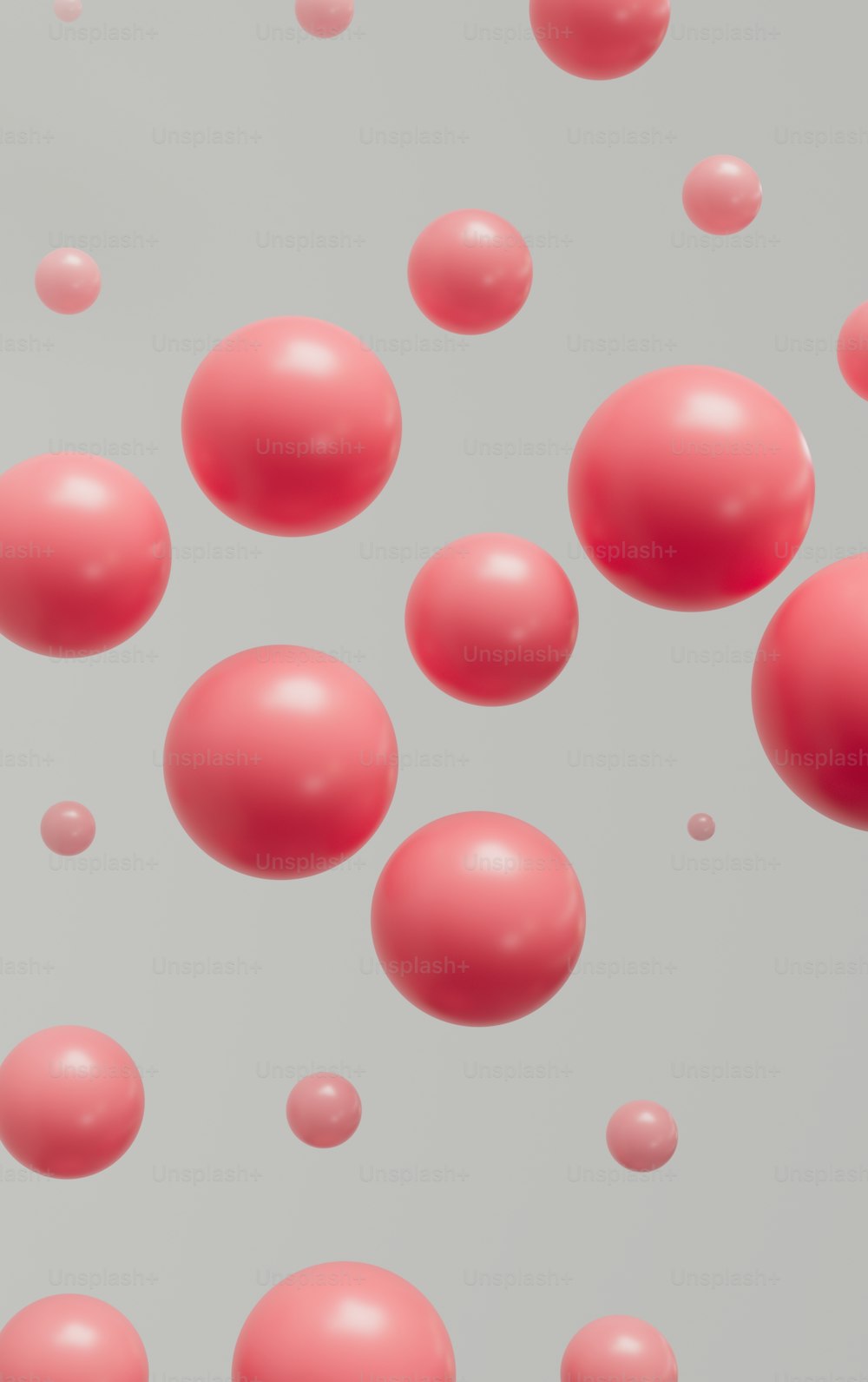 um monte de bolas vermelhas flutuando no ar