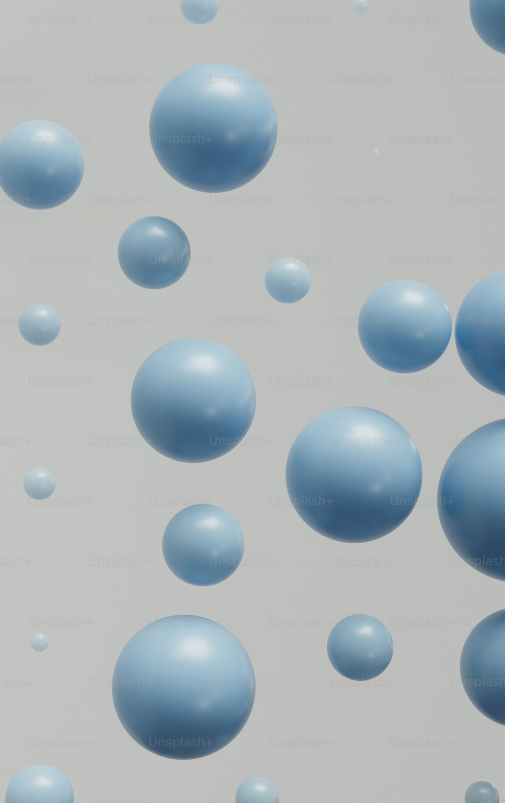 um grupo de bolhas azuis flutuando em cima de uma superfície branca