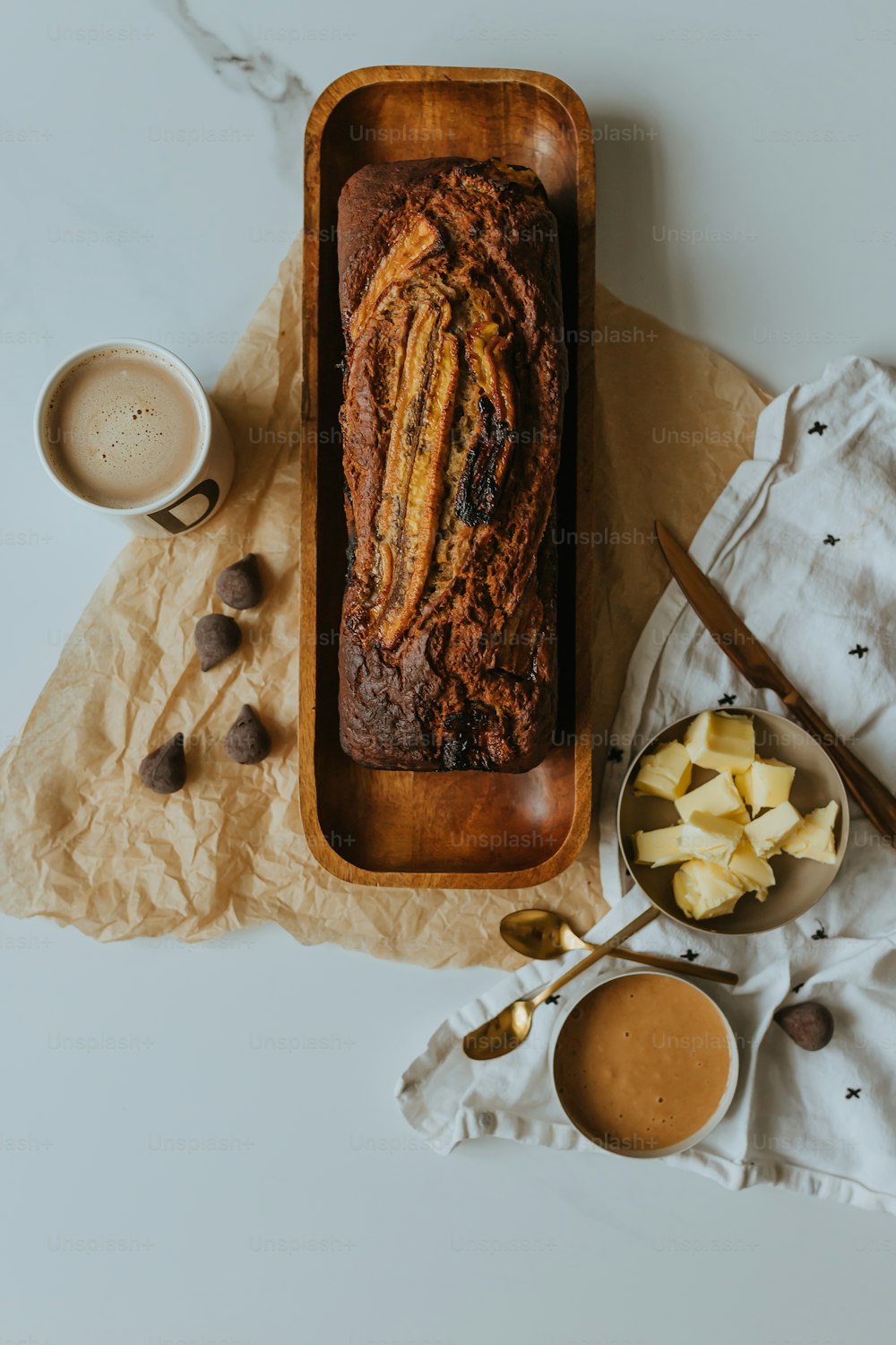 a loaf of bread sitting on top of a wooden tray