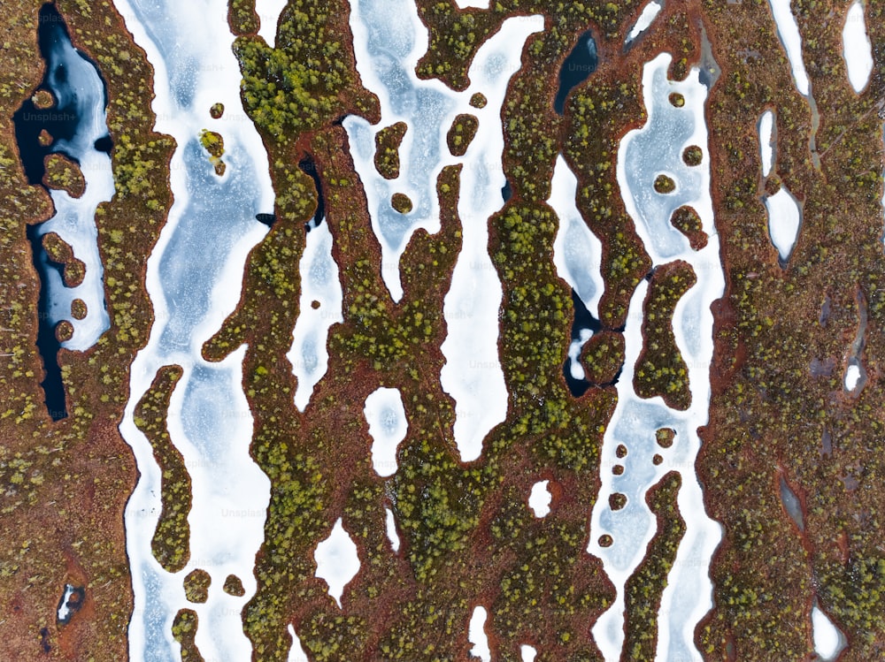 an aerial view of a patch of land covered in snow