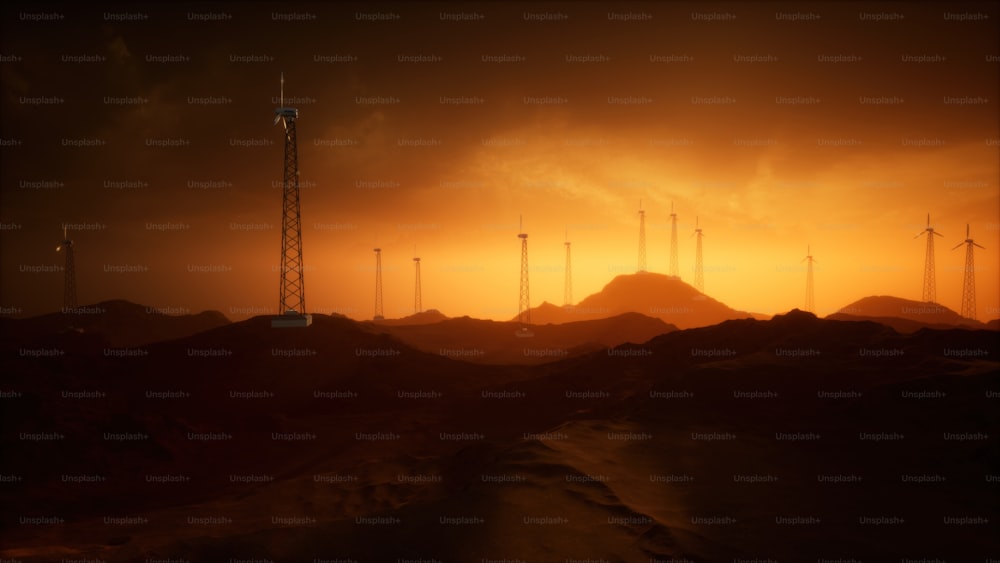 Eine Gruppe von Windmühlen in einer Wüste bei Sonnenuntergang
