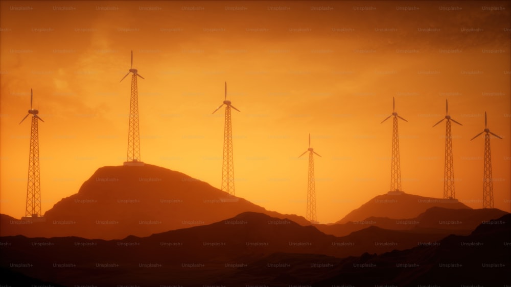 um grupo de turbinas eólicas no topo de uma montanha