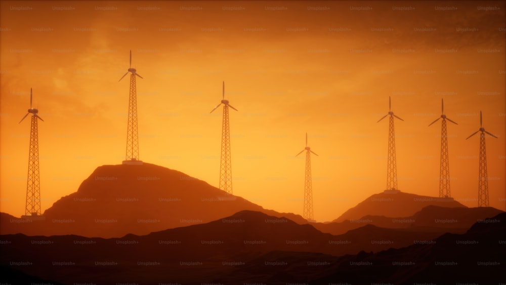 a group of wind turbines on top of a mountain