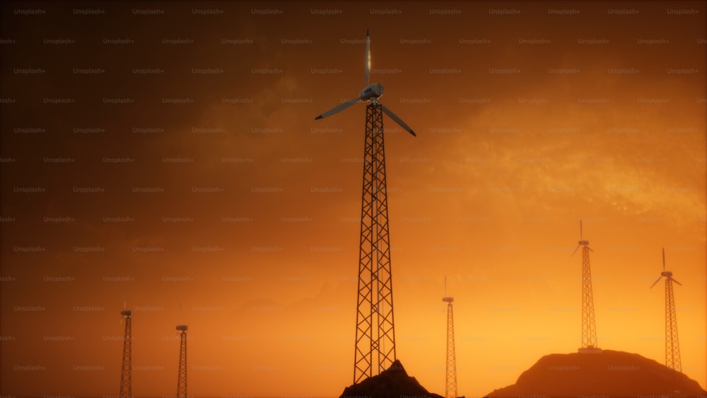 a wind turbine sitting on top of a hill