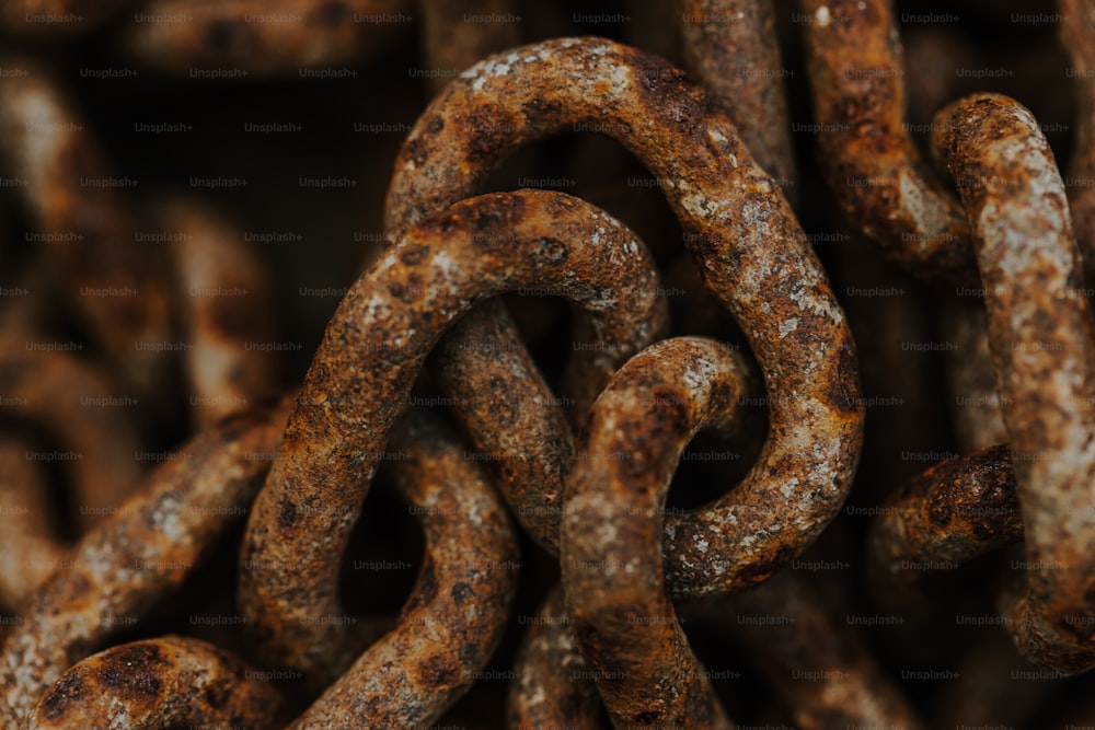 a bunch of rusted metal chains stacked together