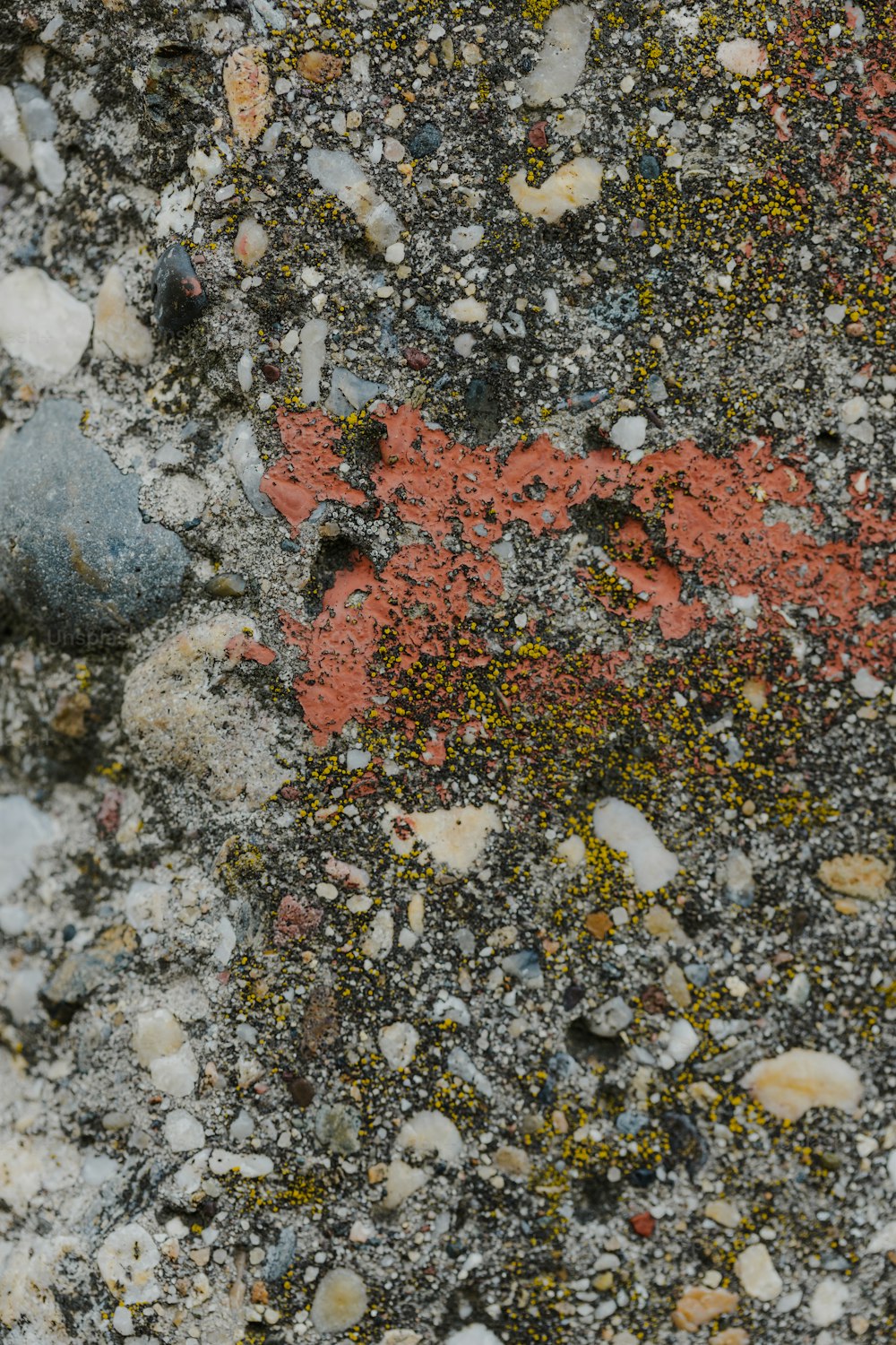 a close up of rocks and gravel with a red star