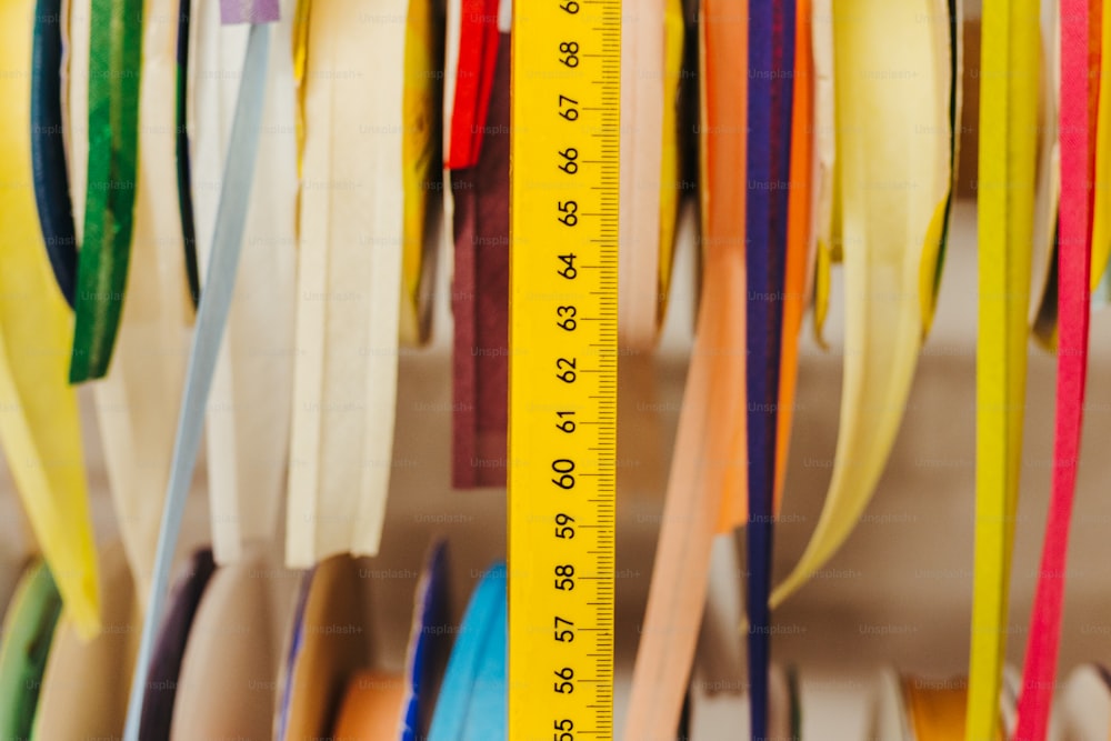 a measuring tape is hanging on a wall