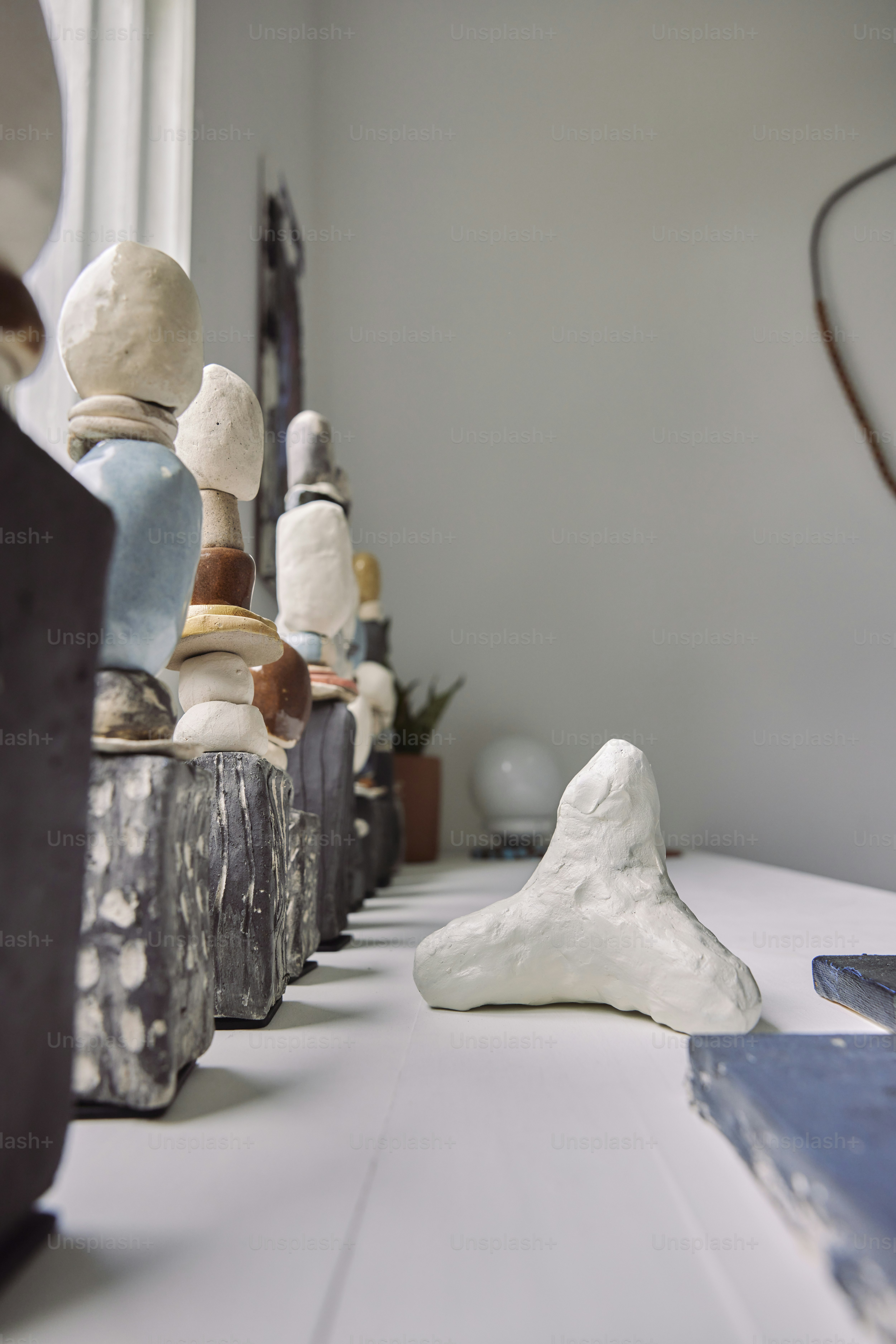 a row of vases sitting on top of a table