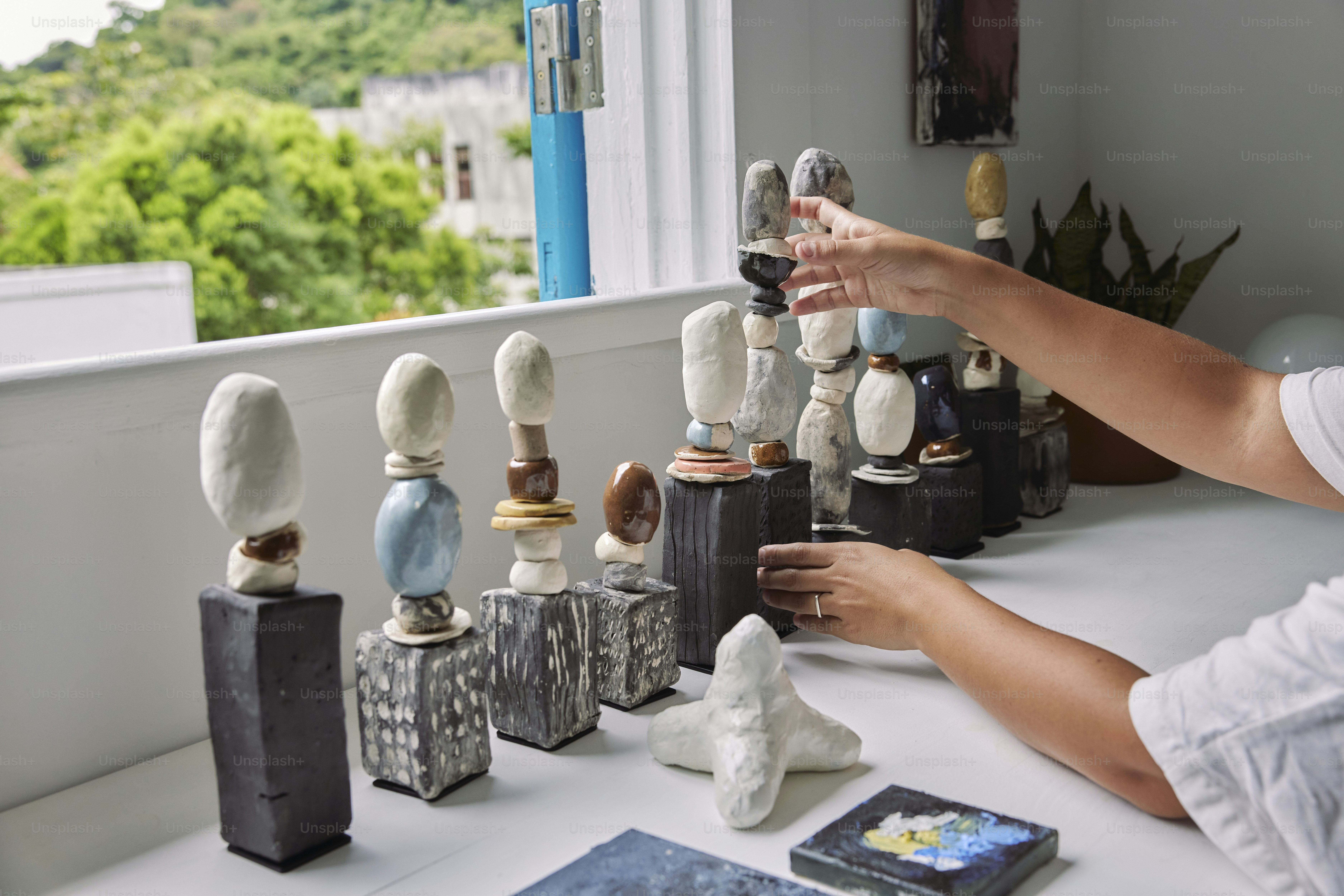 a woman playing a game of chess on a table
