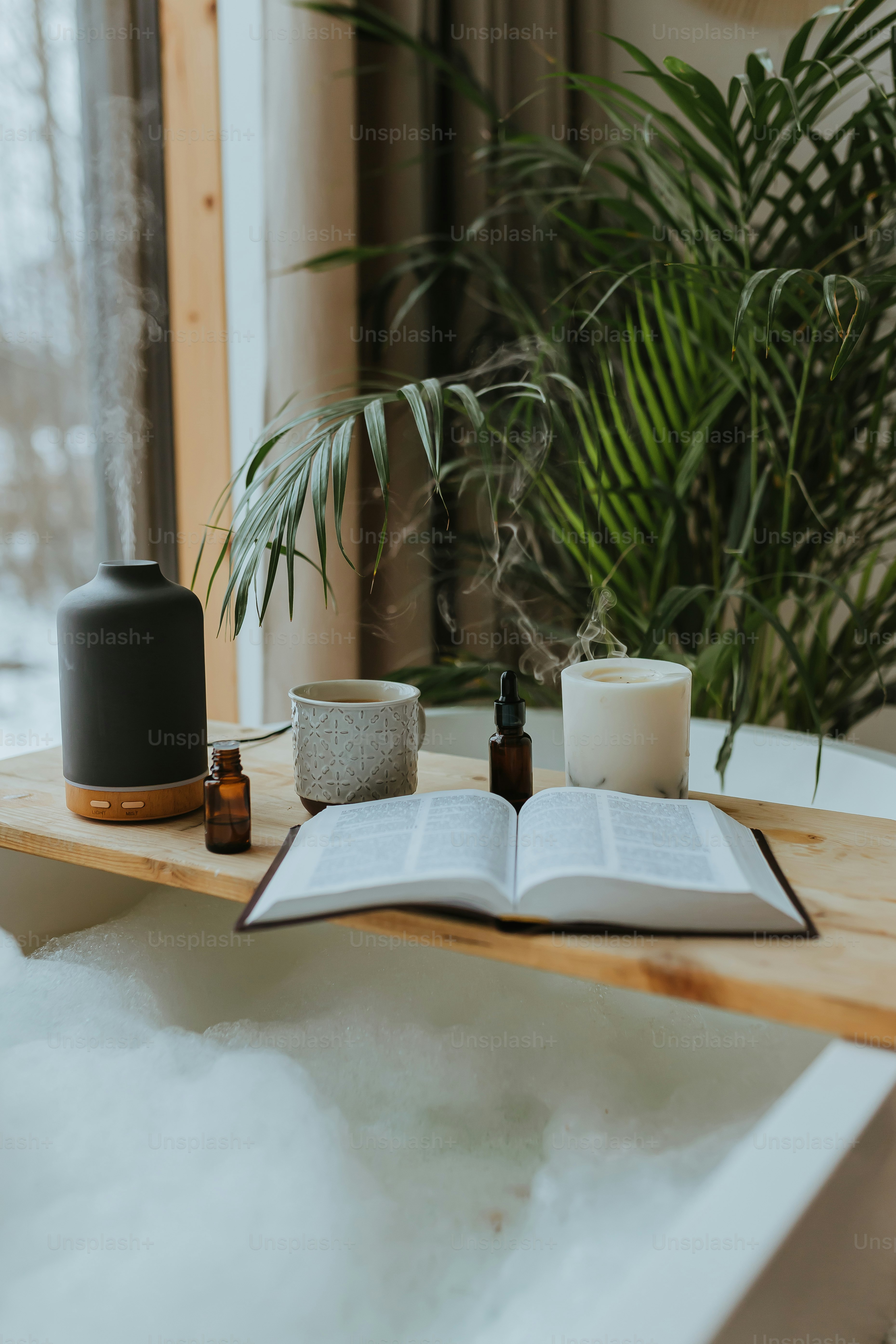 an open book sitting on top of a wooden table