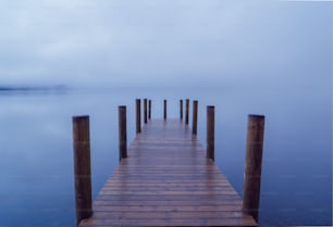 a wooden dock sitting on top of a body of water