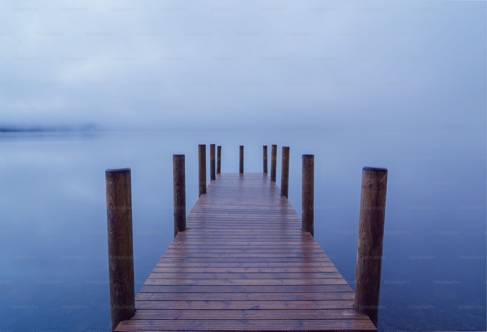 a wooden dock sitting on top of a body of water