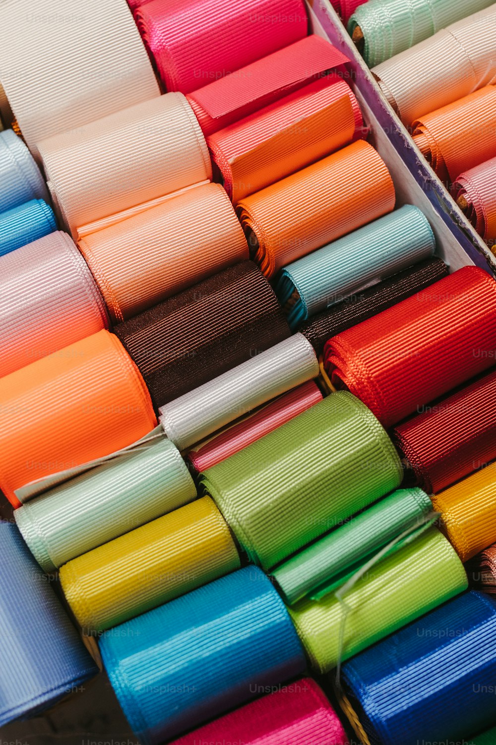 a bunch of different colored ribbons on a table