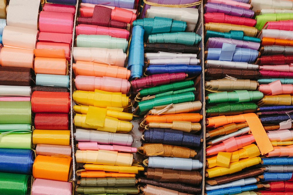 a bunch of different colors of fabric on display