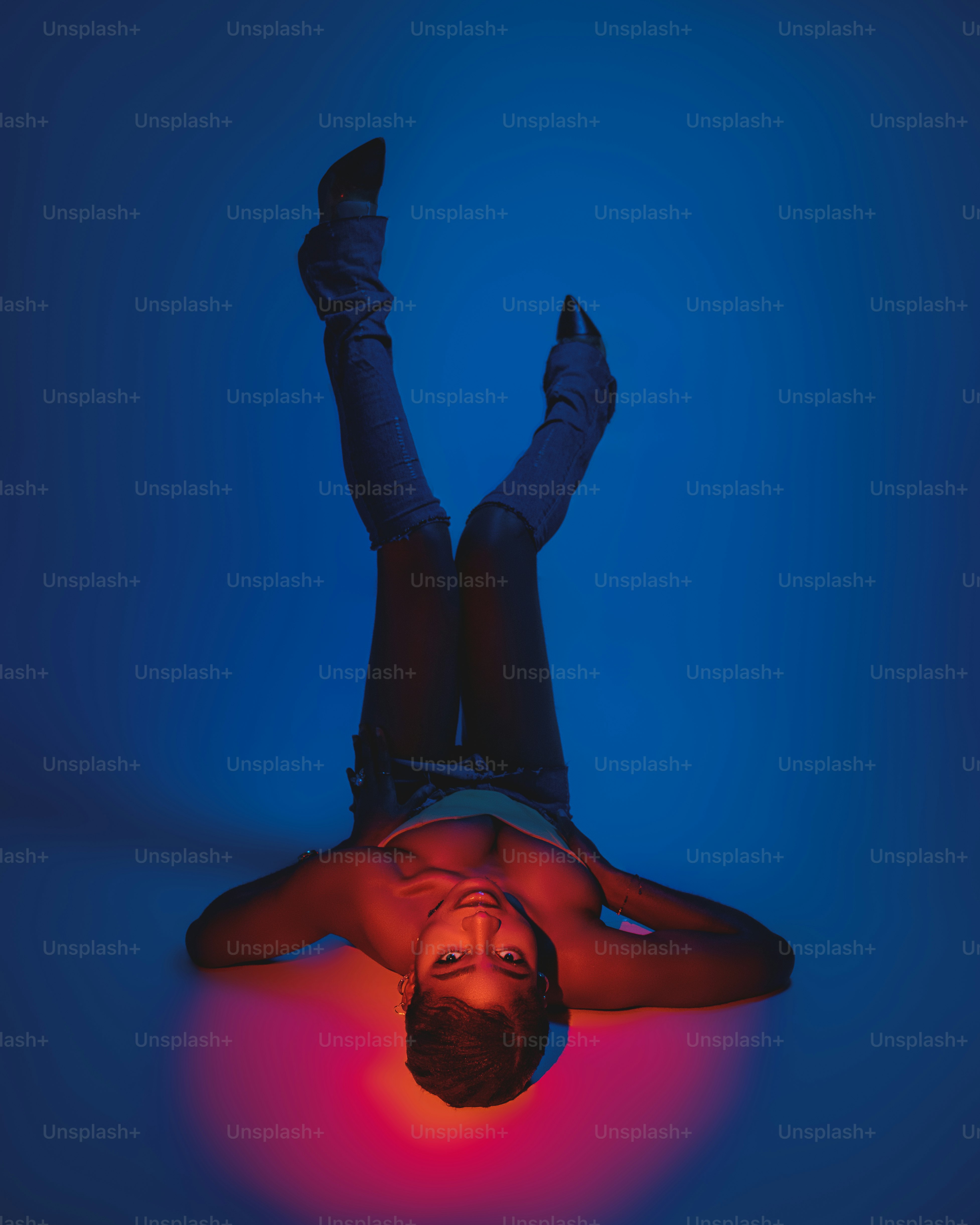 a man laying on the ground with his feet up