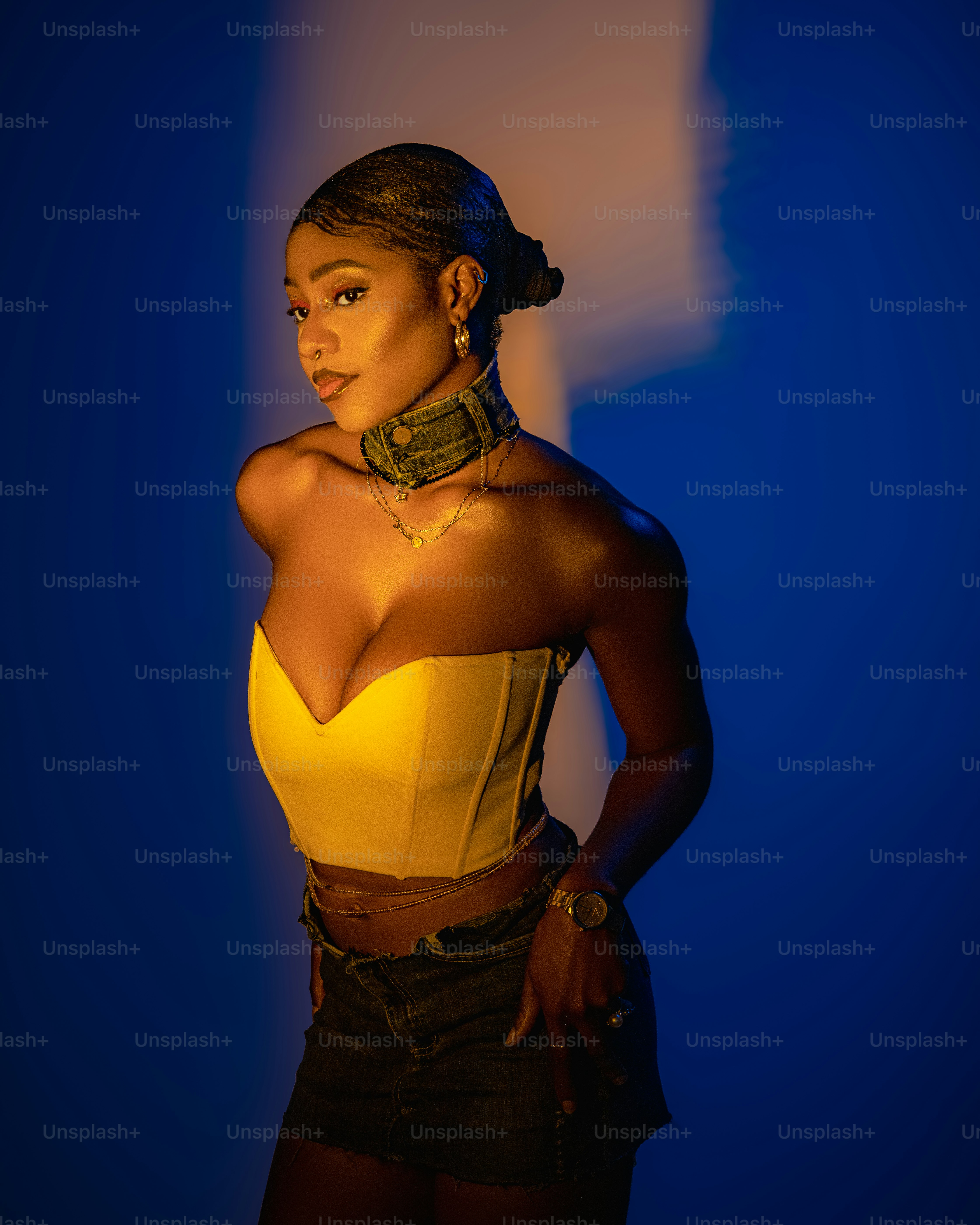 a woman in a yellow top posing for a picture