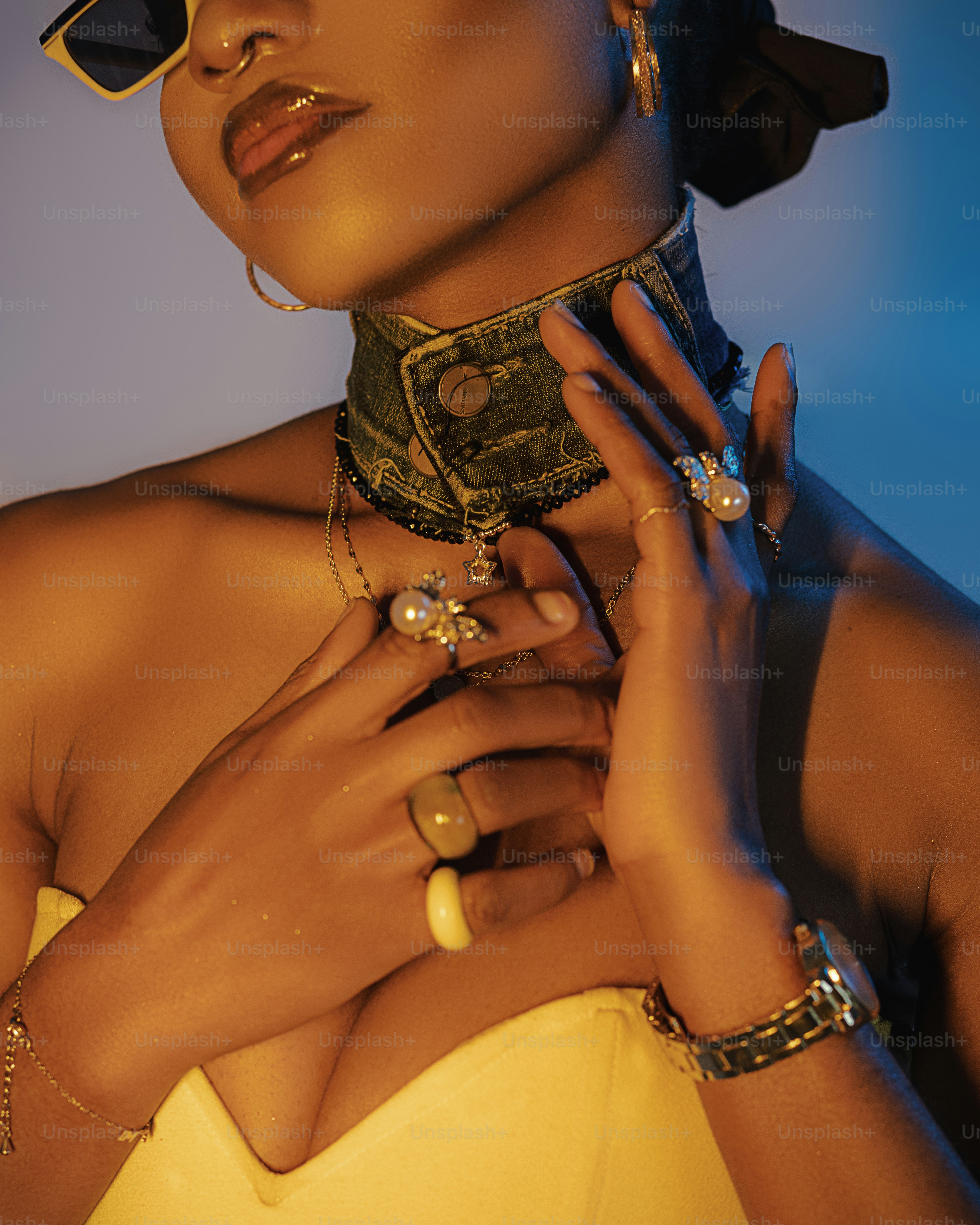 a woman in a yellow dress with a scarf around her neck