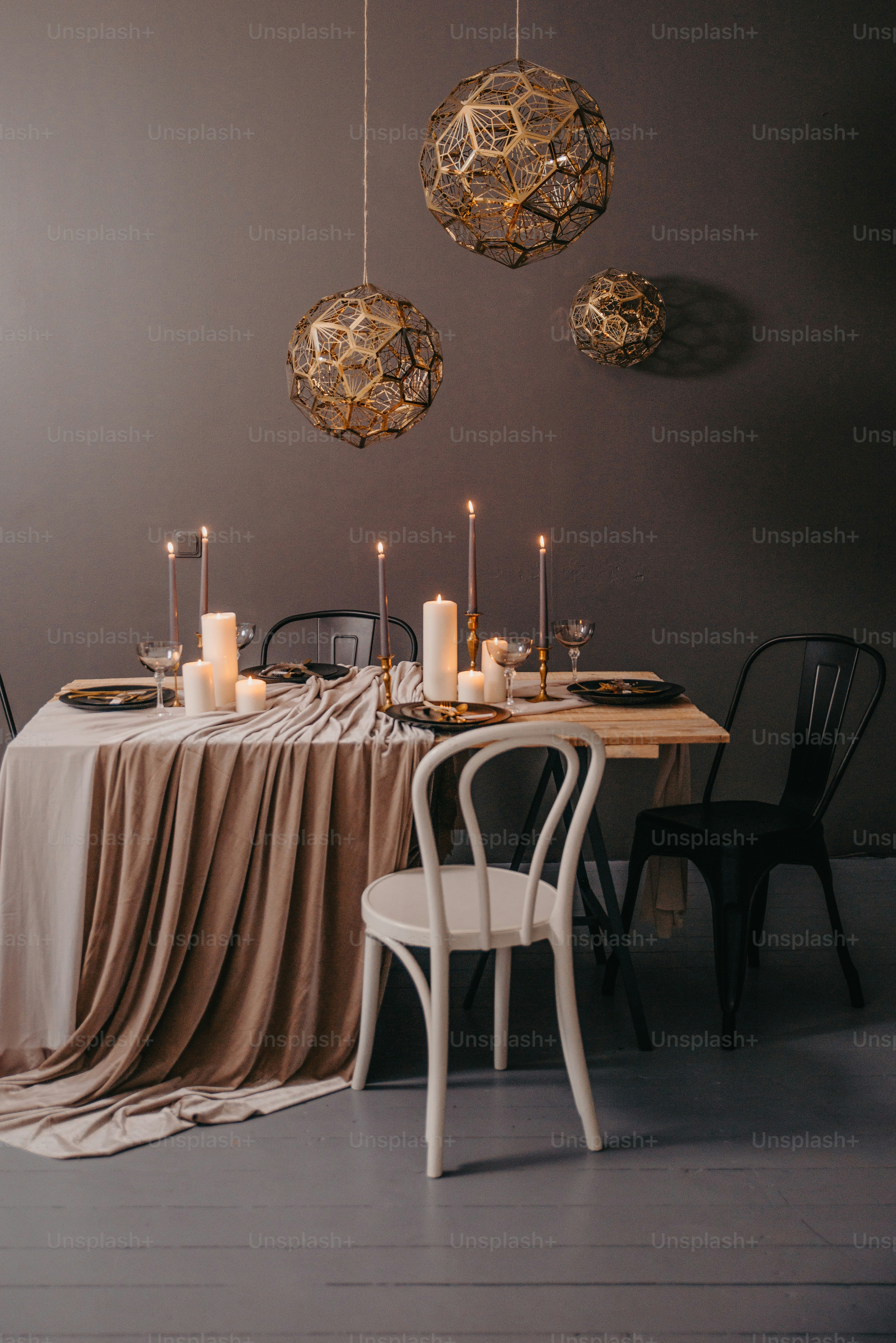 a dining room table with a table cloth draped over it