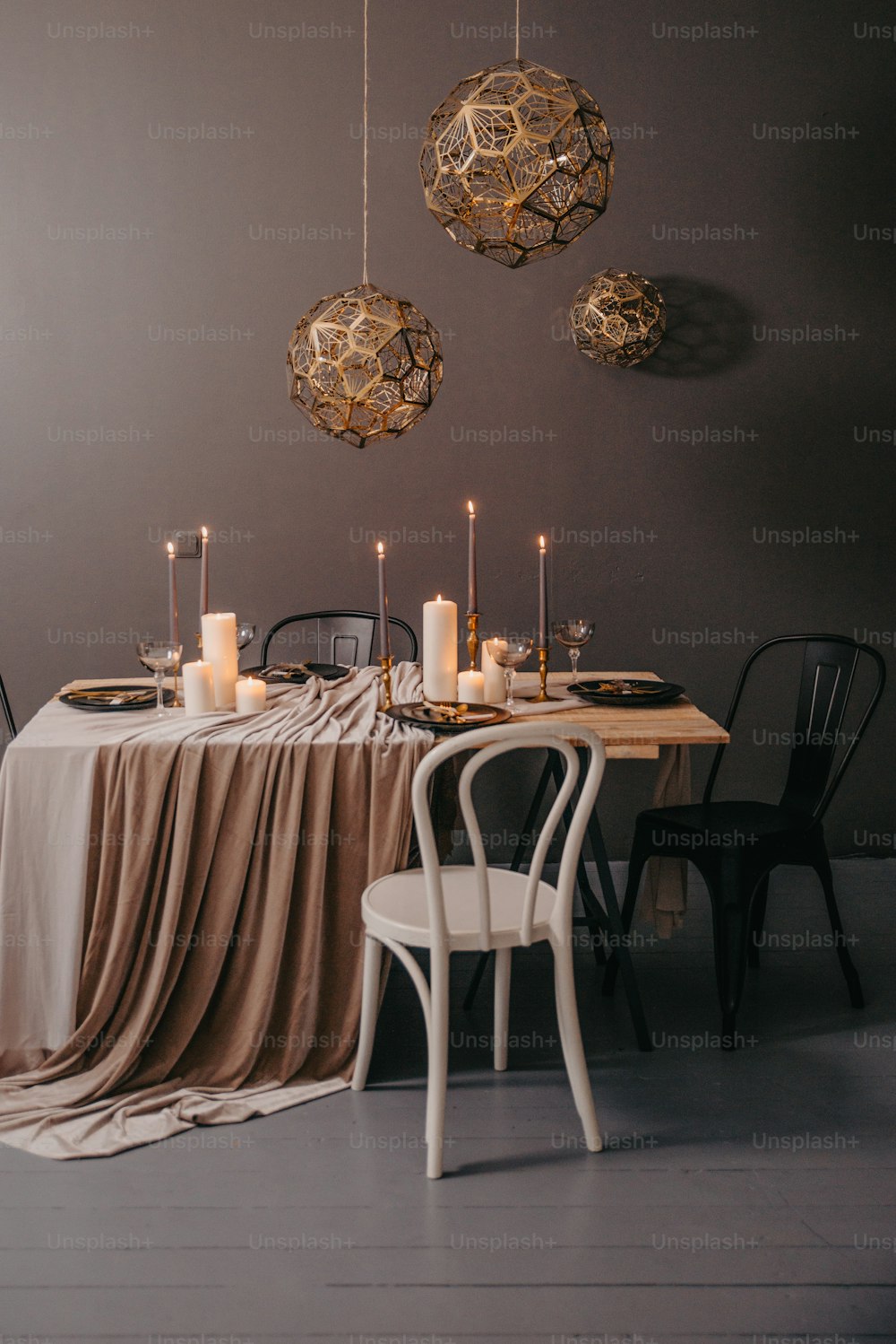 a dining room table with a table cloth draped over it