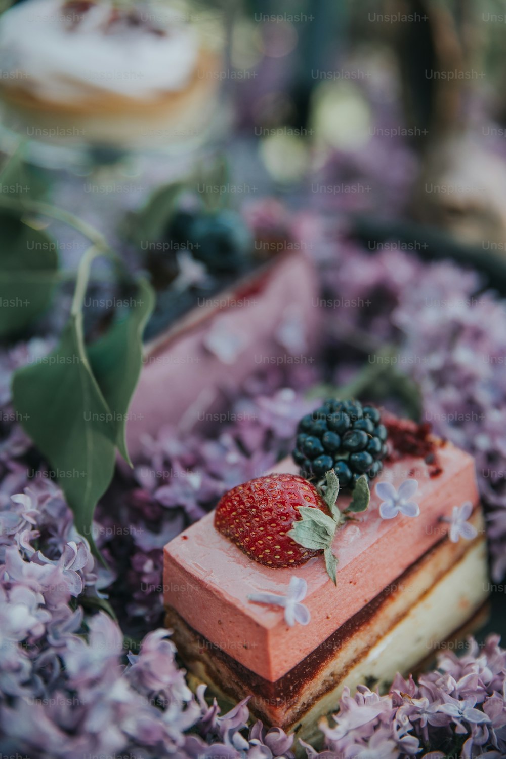 a piece of cake with berries on top of it