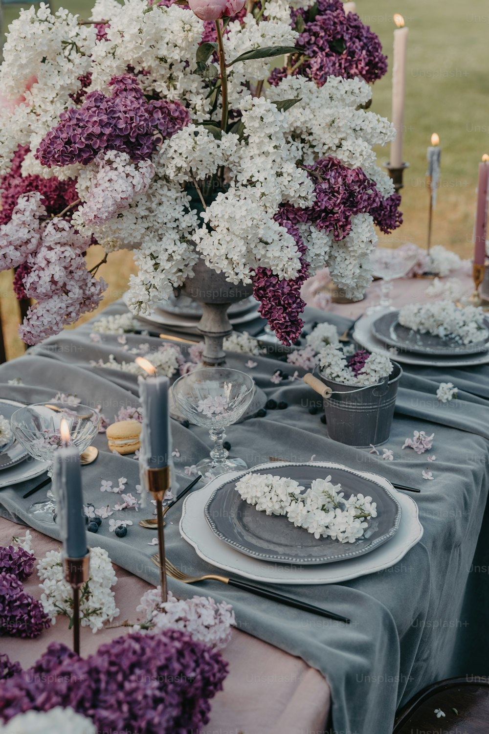 a table is set with flowers and candles
