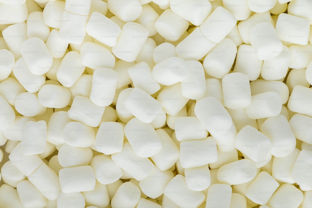 a pile of white marshmallows sitting on top of each other