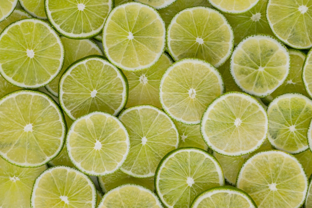 a bunch of limes that are cut in half