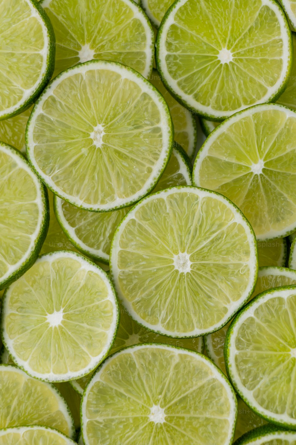 a bunch of limes that are cut in half