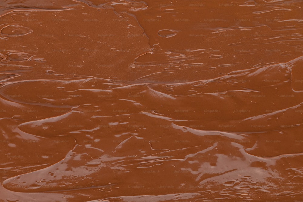 a close up of a chocolate cake with icing on it