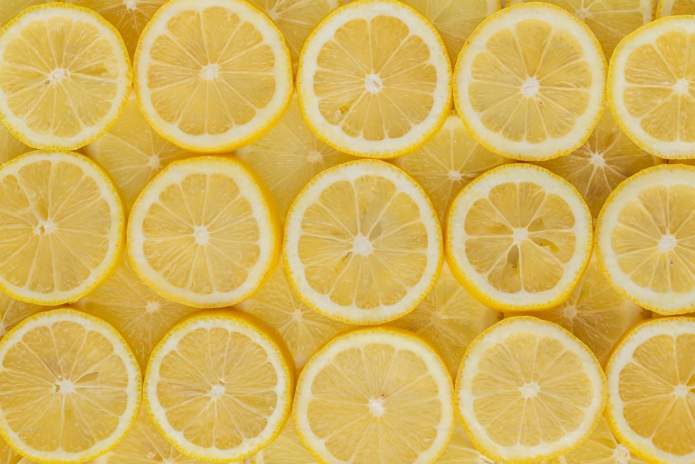 a bunch of lemons that are cut in half