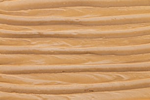 Eine Nahaufnahme der Textur von Erdnussbutter