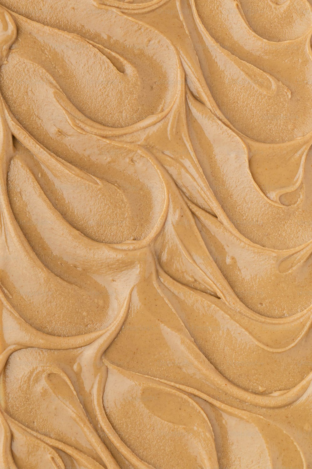 a close up of peanut butter on a plate