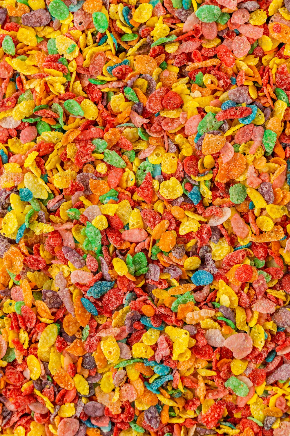 a large pile of colorful candies on a table