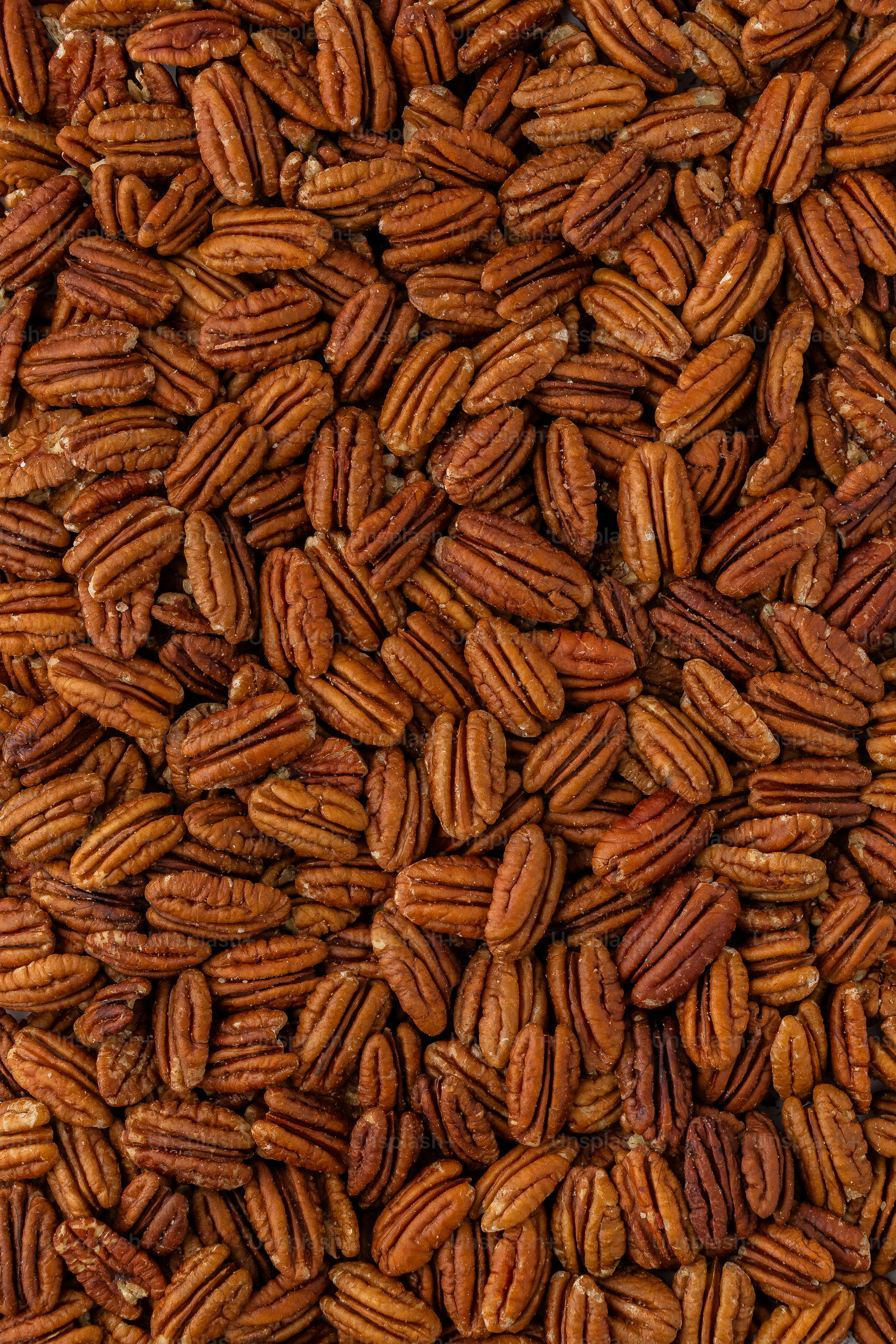 a pile of pecans sitting on top of a table
