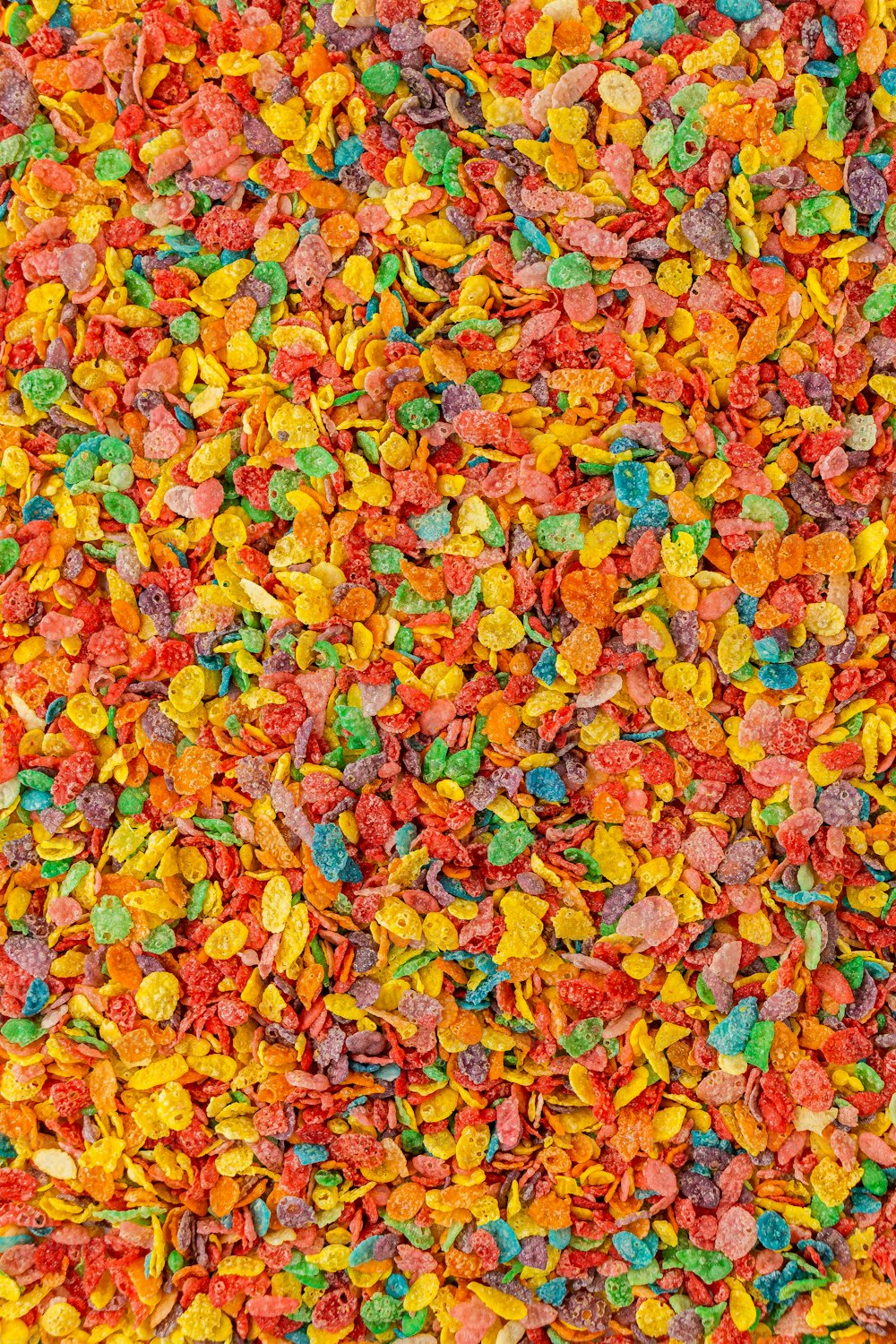 a large pile of colorful candies on a table