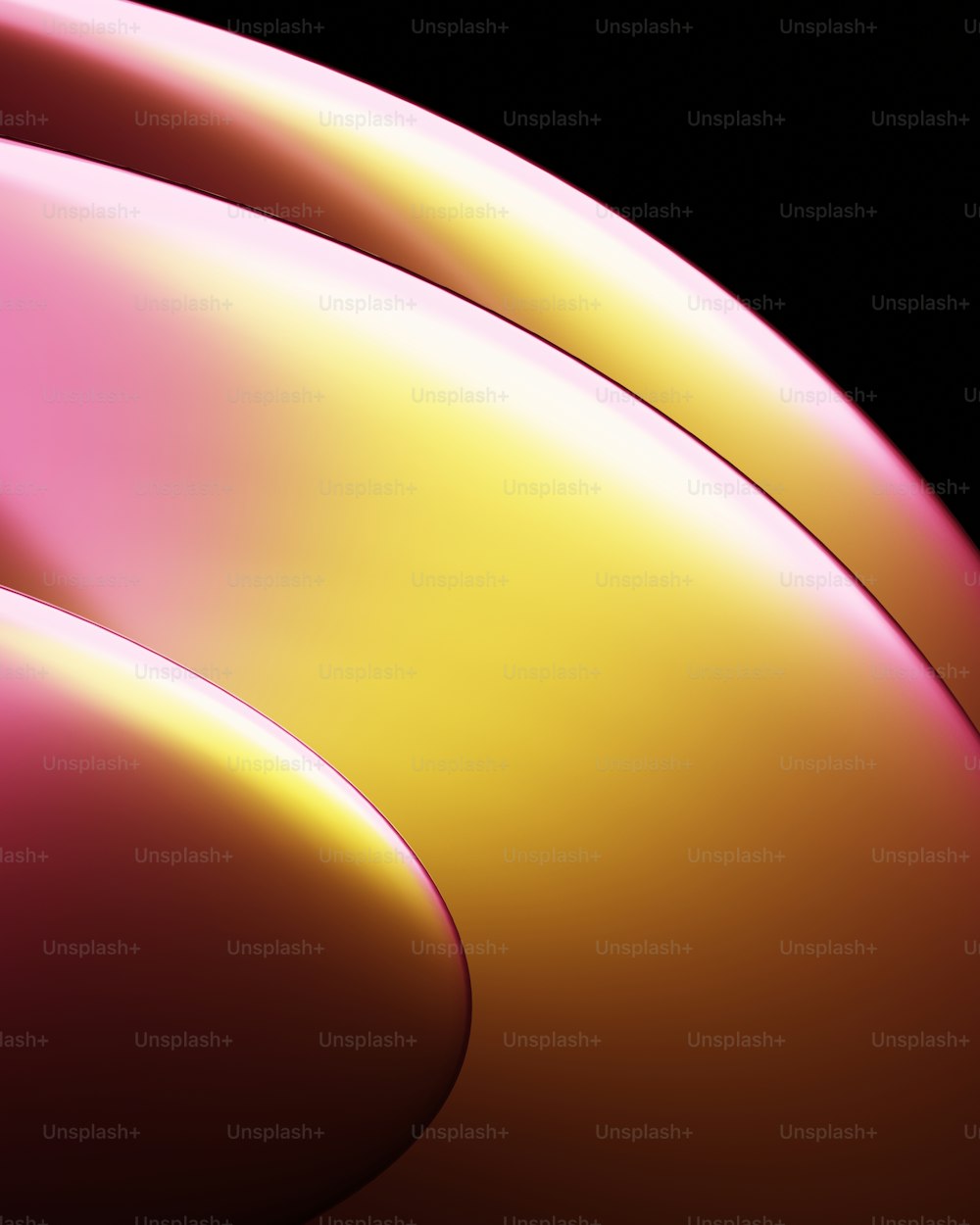 a close up of a pink and yellow object