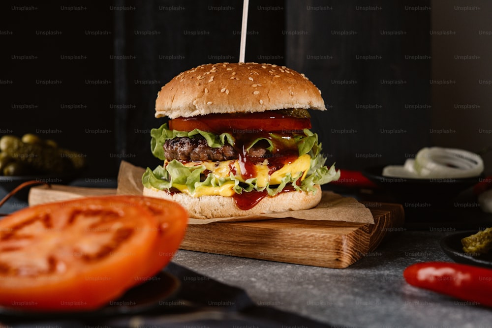 a hamburger sitting on top of a wooden cutting board