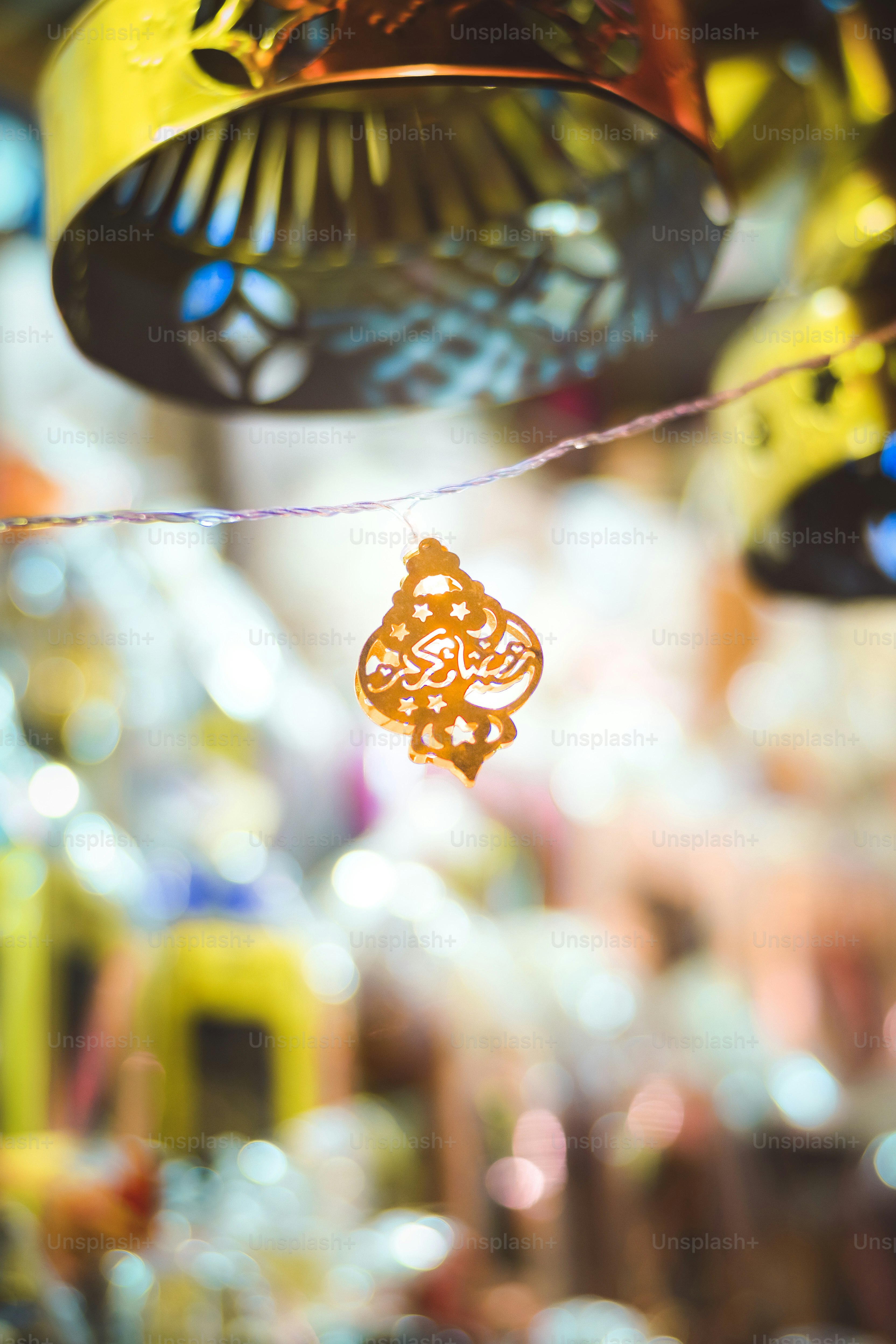 a close up of a wind chime hanging from a ceiling