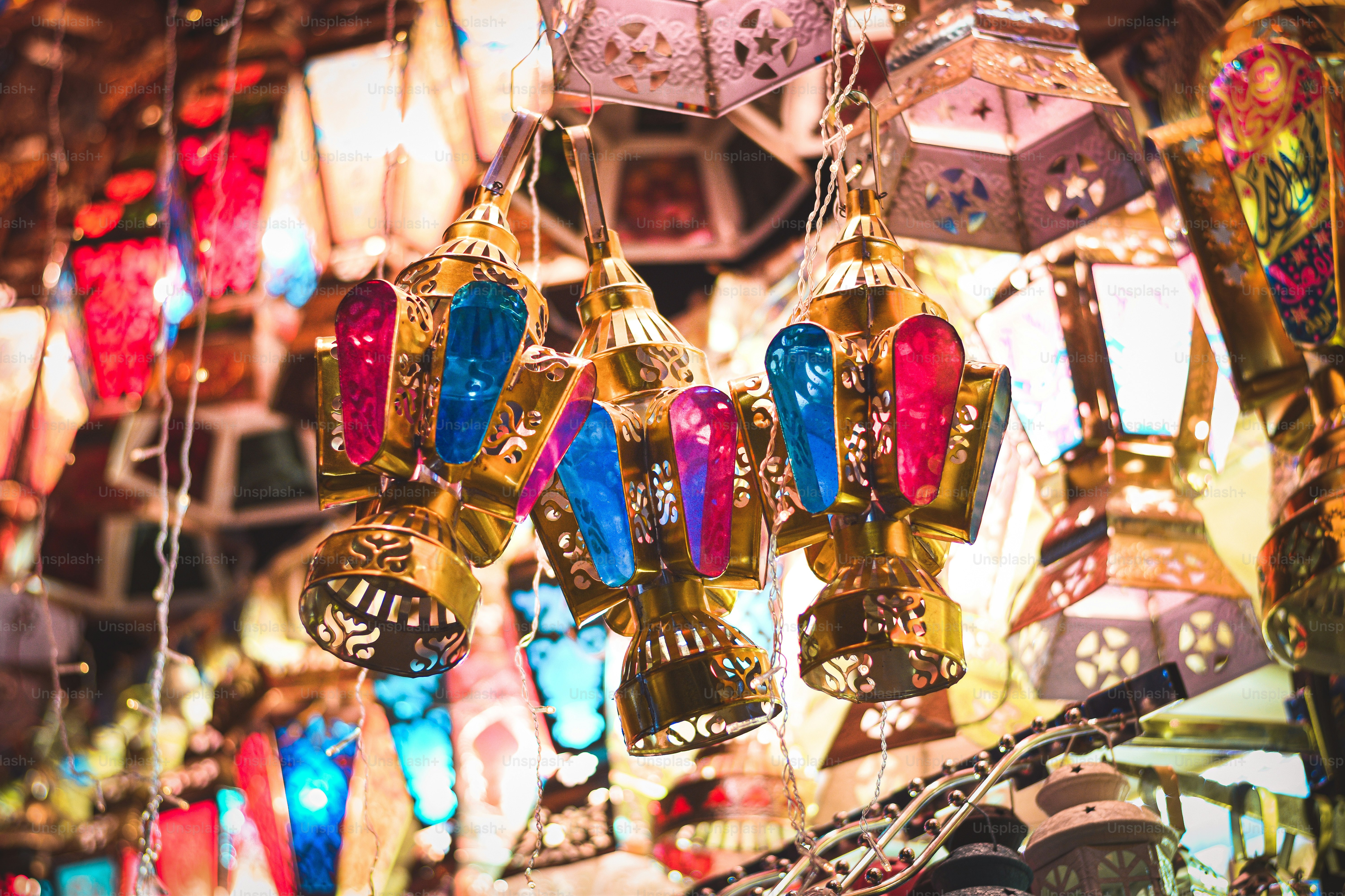 a bunch of colorful lights hanging from a ceiling