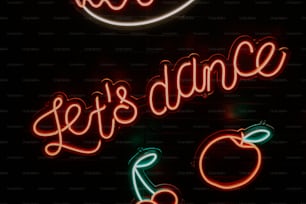um letreiro de néon que diz vamos dançar