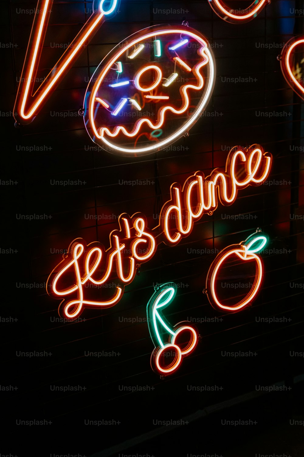 a neon sign that says let's dance