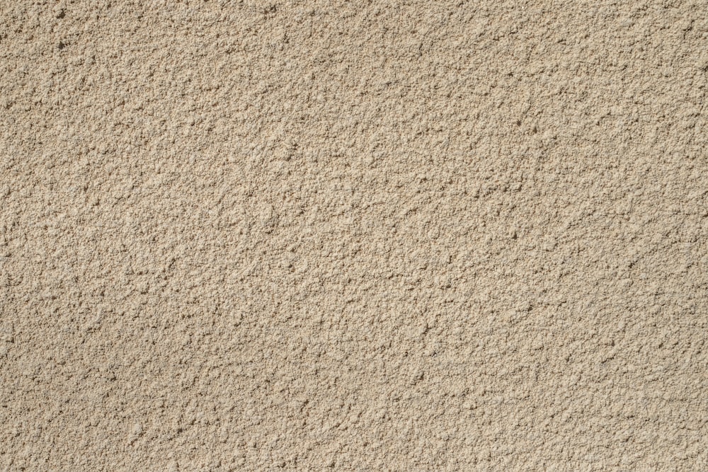 a close up view of a wall made of sand