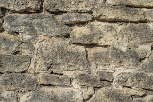 a close up of a stone wall made of rocks